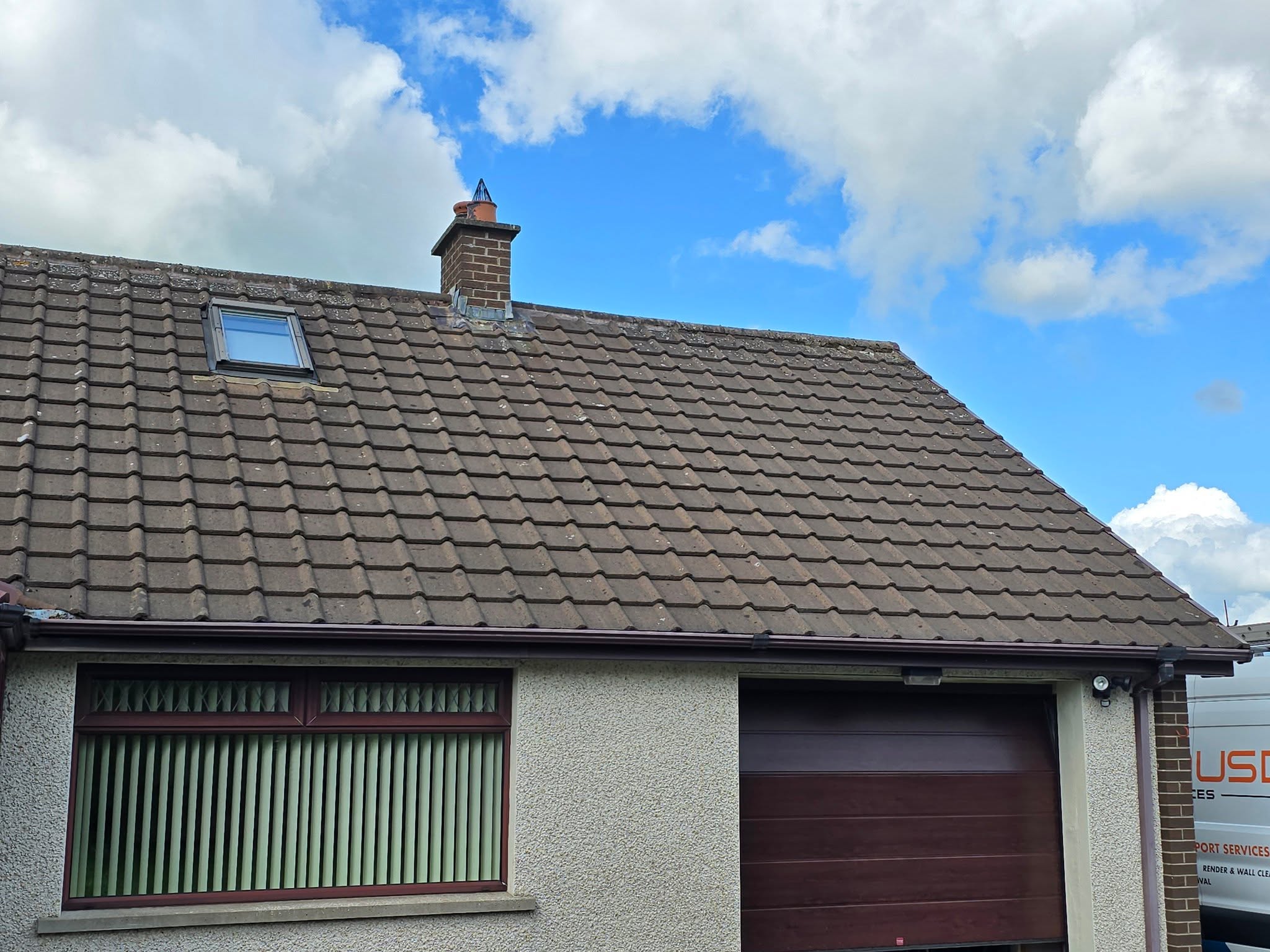 Completed roof clean on Northern Ireland bungalow showing restored tiles